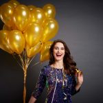 woman with golden balloons
