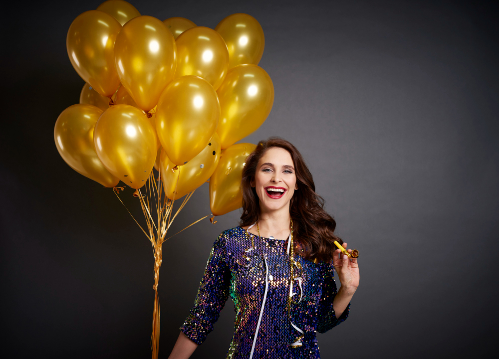 woman with golden balloons