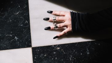 girl with black halloween nails