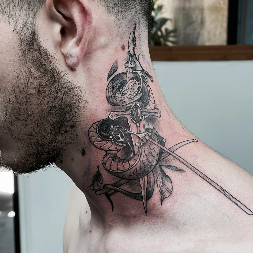 Snake and Dagger Neck Tattoo