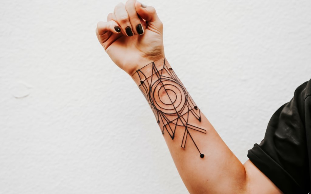 minimalist line art forearm tattoos