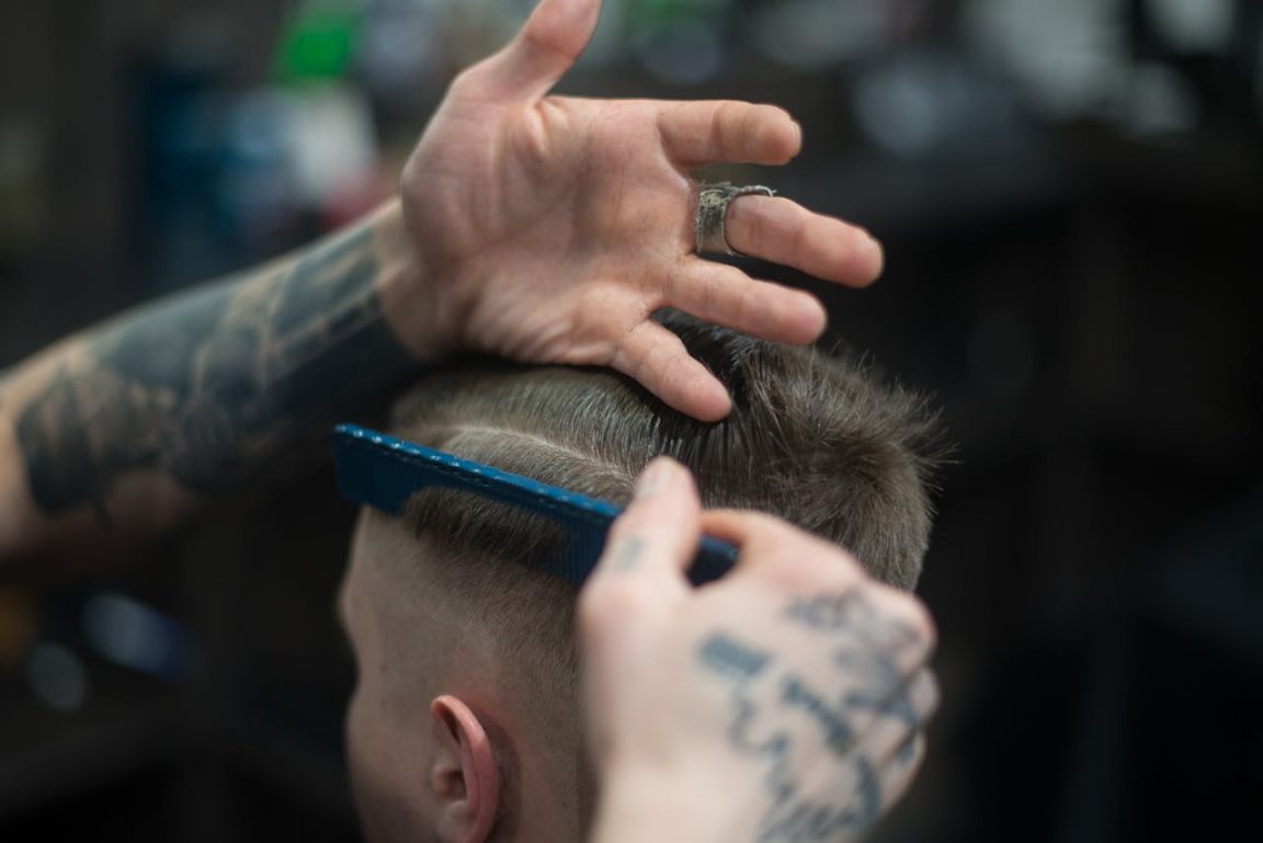 a barber hair cutting for men